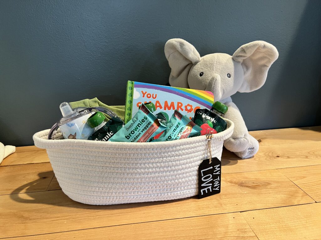Cream rope basket with St Patrick's day gifts for toddler.